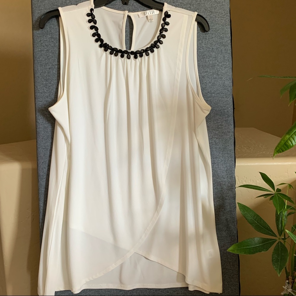 Nice beautiful white blouse with black stones, never wormed!